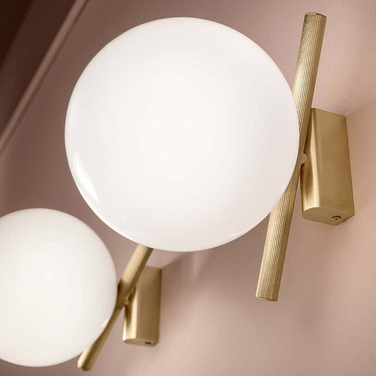 Modern gold and white LED wall lamp with glass shade for bedroom and living room